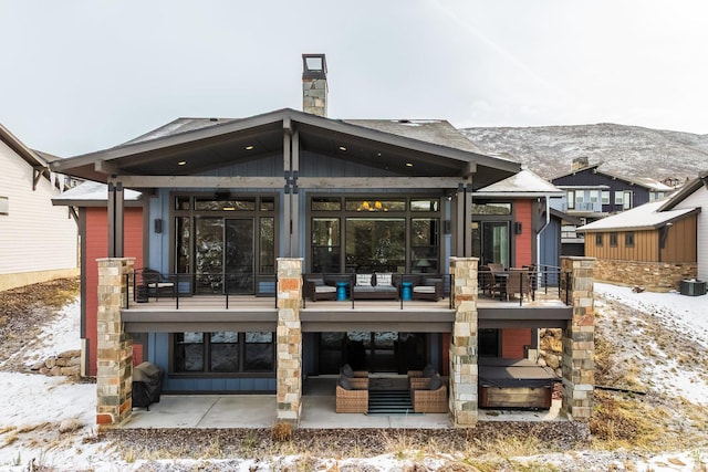 12709 N Belaview Way, Hideout, UT 84036 - snow covered property with a patio area, a mountain view, outdoor lounge area, and a chimney