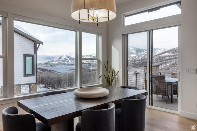 12709 N Belaview Way, Hideout, UT 84036 - dining room featuring an inviting chandelier, light wood-style flooring, baseboards, and a mountain view