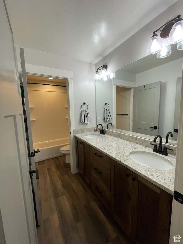3525 S Sweetwater Pkwy, Garden City, UT 84028 - bathroom featuring double vanity and wood finished floors