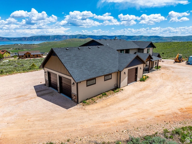 3525 S Sweetwater Pkwy, Garden City, UT 84028 - aerial view of property and surrounding area with a mountain backdrop