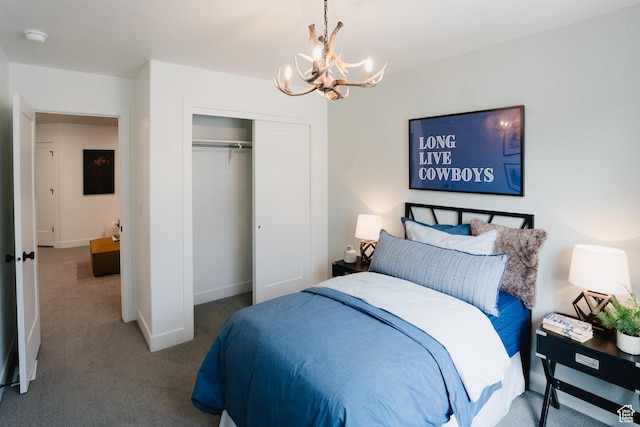 bedroom featuring a chandelier, a closet, baseboards, and carpet floors