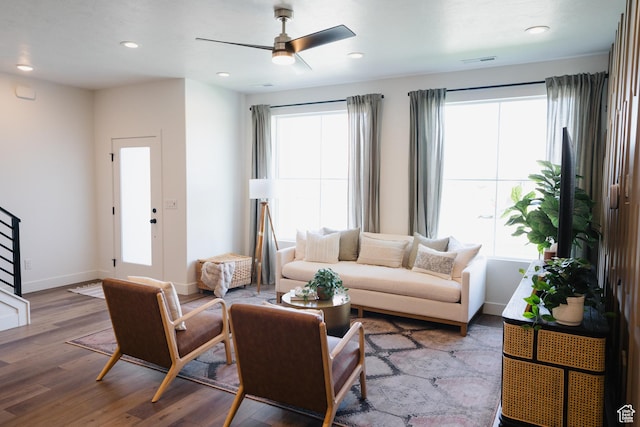 living room with a ceiling fan, visible vents, recessed lighting, wood finished floors, and baseboards
