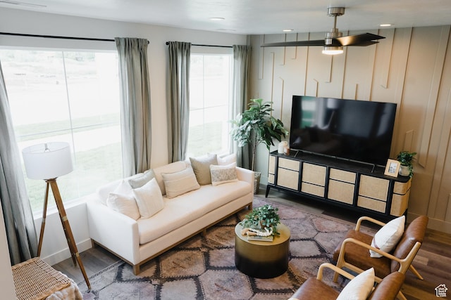 living area with wood finished floors and baseboards