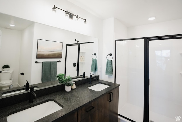 full bathroom with a shower stall, a sink, and toilet