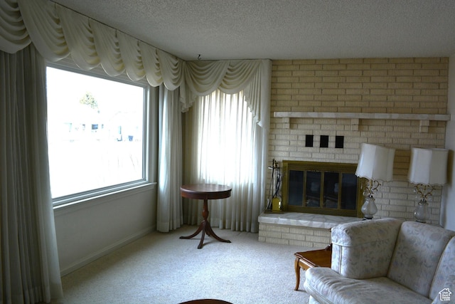 418 N 9th St, Montpelier, ID 83254 - sitting room featuring baseboards, carpet flooring, a brick fireplace, and a textured ceiling