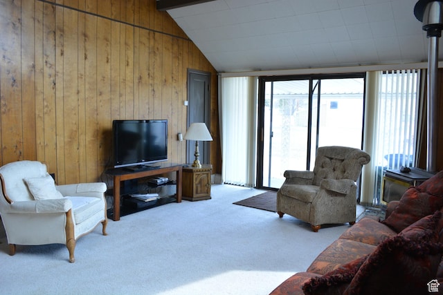 418 N 9th St, Montpelier, ID 83254 - living room with wooden walls, carpet floors, and lofted ceiling with beams