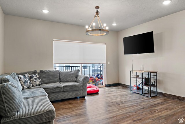 1128 S 820 E Unit 8204, Heber City, UT 84032 - living area featuring baseboards, an inviting chandelier, a textured ceiling, recessed lighting, and wood finished floors