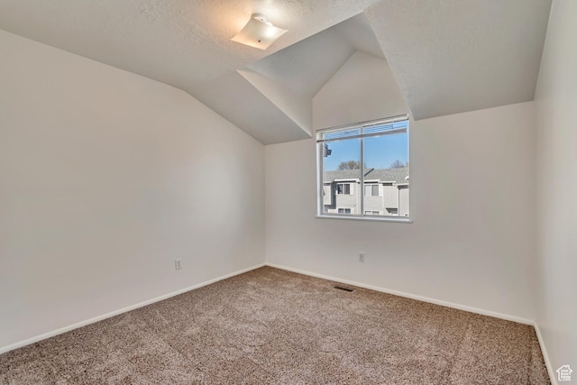 241 E Crestone Ave Unit 16A, South Salt Lake, UT 84115 - bonus room with baseboards, lofted ceiling, carpet, and visible vents