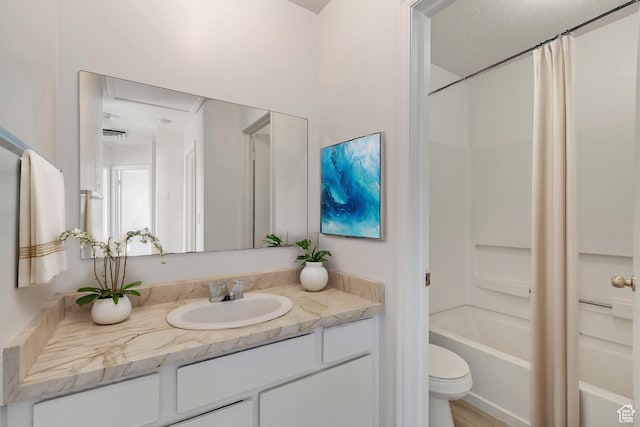 241 E Crestone Ave Unit 16A, South Salt Lake, UT 84115 - bathroom featuring toilet, shower / bathtub combination with curtain, and vanity
