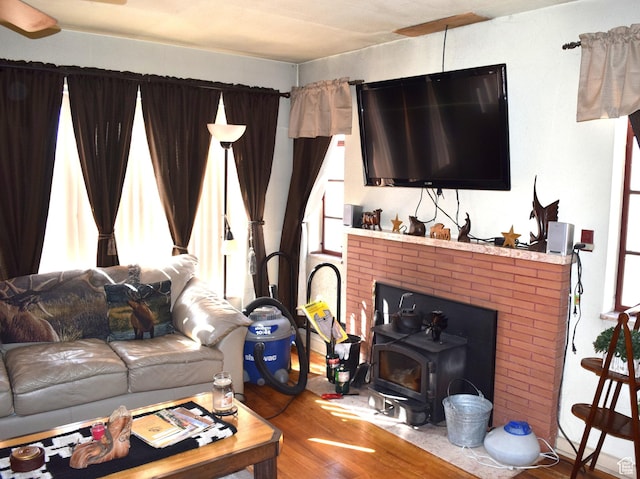 255 S Center St, Circleville, UT 84723 - living room with plenty of natural light, a wood stove, and wood finished floors