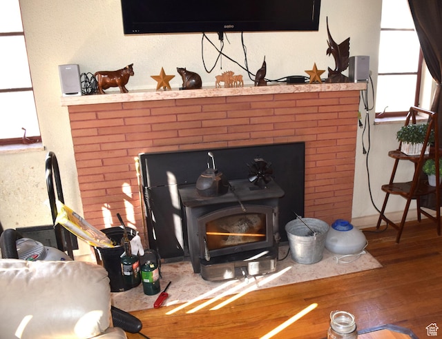255 S Center St, Circleville, UT 84723 - room details with wood finished floors, a wood stove, and baseboards