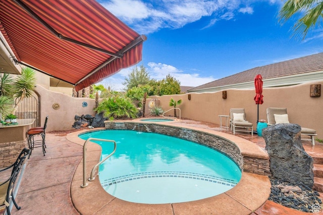 2090 N Tuweap Dr Unit 2, St George, UT 84770 - view of swimming pool featuring a fenced in pool, a patio area, a fenced backyard, and an in ground hot tub