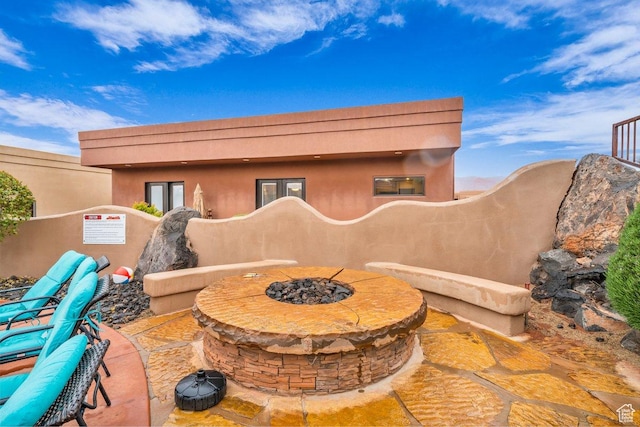 2090 N Tuweap Dr Unit 2, St George, UT 84770 - view of patio / terrace with a fire pit
