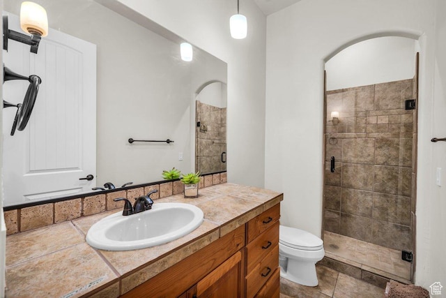 2090 N Tuweap Dr Unit 2, St George, UT 84770 - full bathroom with a shower stall, vanity, tile patterned flooring, and toilet