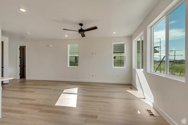 spare room featuring recessed lighting, light wood finished floors, visible vents, and ceiling fan
