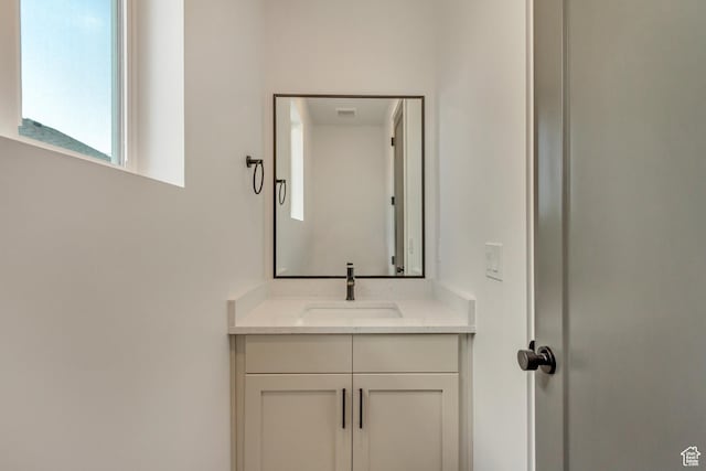 bathroom with visible vents and vanity