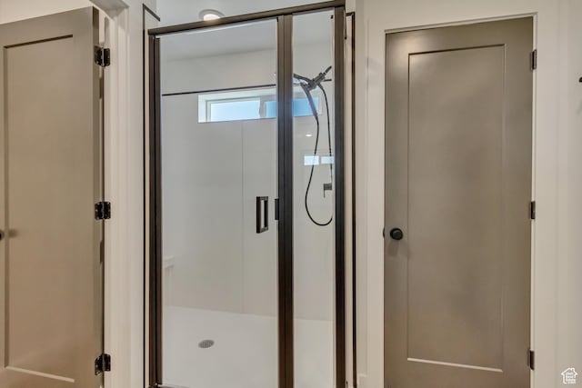 bathroom featuring a shower stall