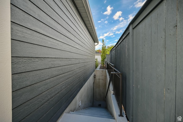 view of side of property with a balcony