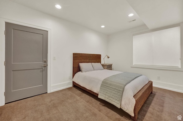 carpeted bedroom featuring baseboards, visible vents, and recessed lighting
