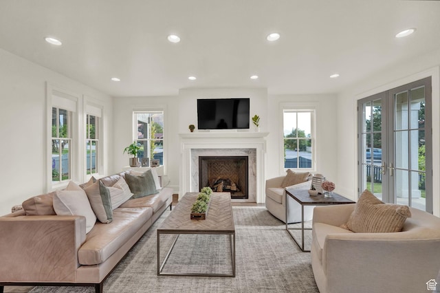 living room featuring recessed lighting and a fireplace