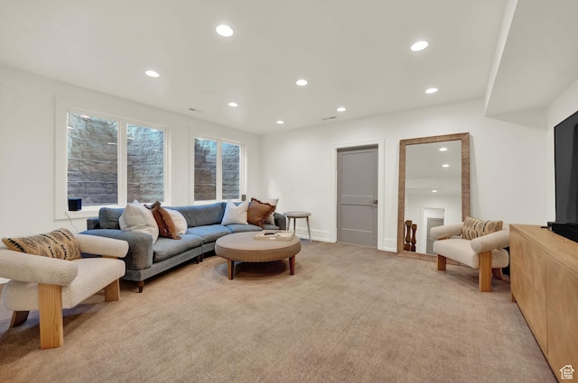 living room with light colored carpet and recessed lighting