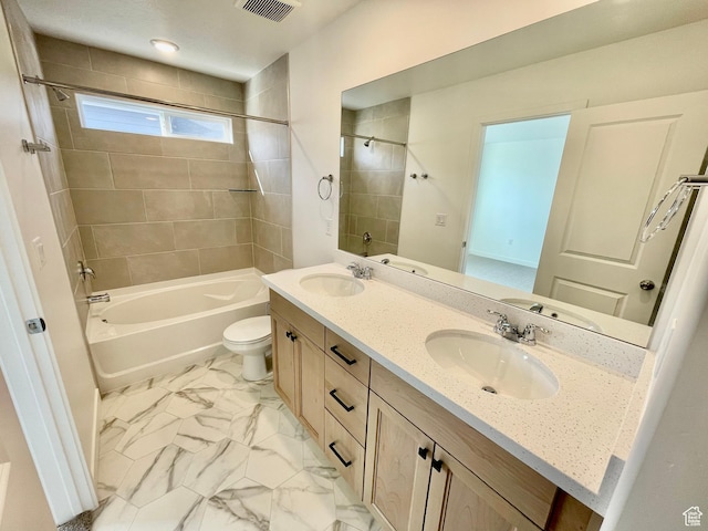 full bathroom with visible vents, a sink, toilet, shower / bath combination, and marble finish floor
