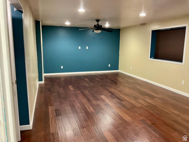 empty room with dark wood-style flooring, baseboards, a ceiling fan, and recessed lighting