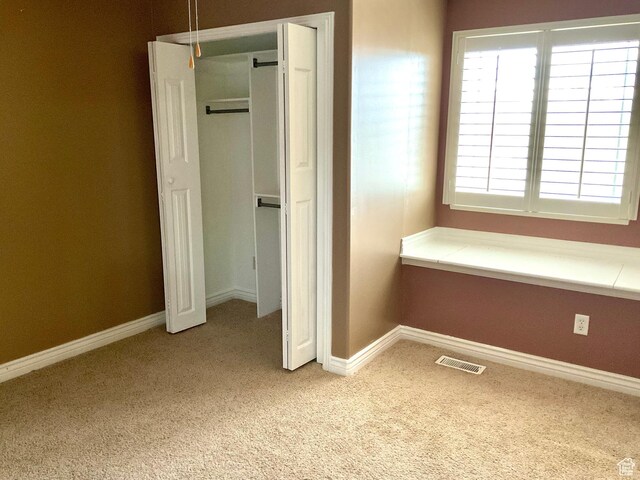 2461 N 2710 W, Clinton, UT 84015 - unfurnished bedroom with carpet floors, baseboards, and a closet