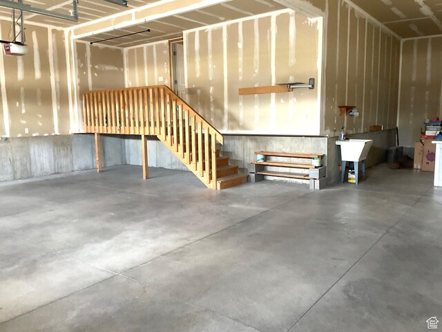 2461 N 2710 W, Clinton, UT 84015 - garage featuring a garage door opener and a sink