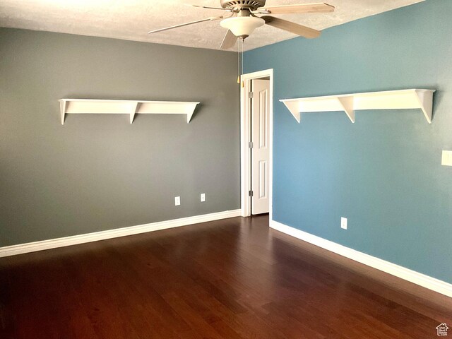 2461 N 2710 W, Clinton, UT 84015 - empty room with a ceiling fan, dark wood-type flooring, and baseboards