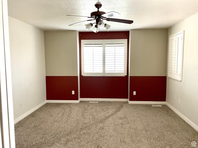 2461 N 2710 W, Clinton, UT 84015 - empty room with a ceiling fan, carpet, and baseboards