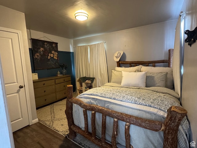 bedroom featuring wood finished floors