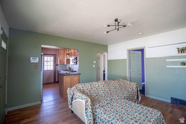 180 E Southgate Ave S, Salt Lake City, UT 84115 - bedroom with arched walkways, wood finished floors, baseboards, and visible vents