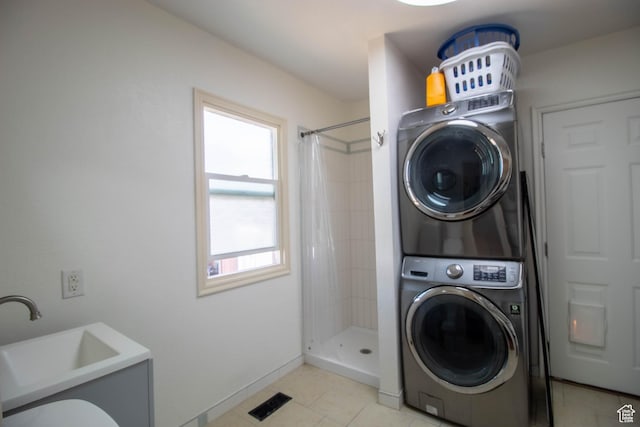 180 E Southgate Ave S, Salt Lake City, UT 84115 - clothes washing area featuring laundry area, light tile patterned floors, visible vents, a sink, and stacked washer and clothes dryer