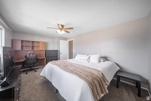bedroom with carpet, a textured ceiling, and ceiling fan