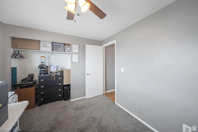 carpeted bedroom featuring baseboards and a ceiling fan