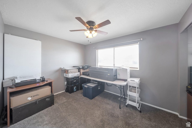 carpeted office with baseboards, a ceiling fan, and a textured ceiling