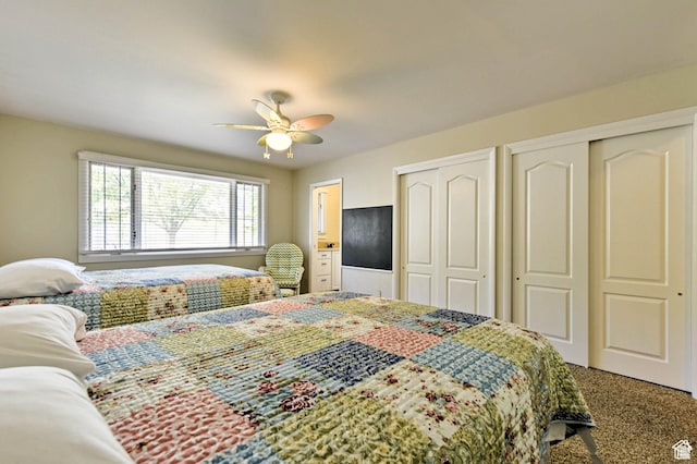 1050 S 200 W, Wellsville, UT 84339 - bedroom with carpet flooring, two closets, and a ceiling fan