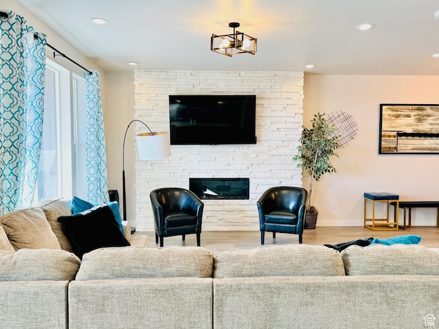 451 W Glenview Loop, Heber City, UT 84032 - living room featuring a stone fireplace, recessed lighting, wood finished floors, and baseboards