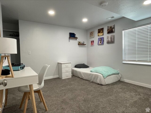 bedroom with baseboards, recessed lighting, and carpet floors