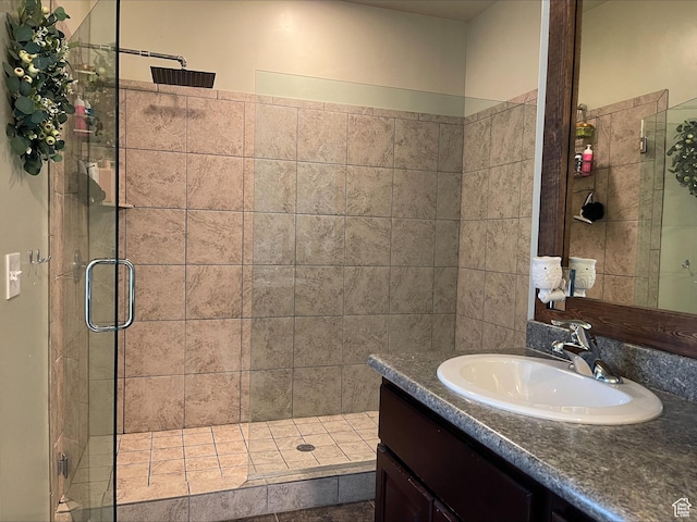 bathroom featuring vanity and a stall shower