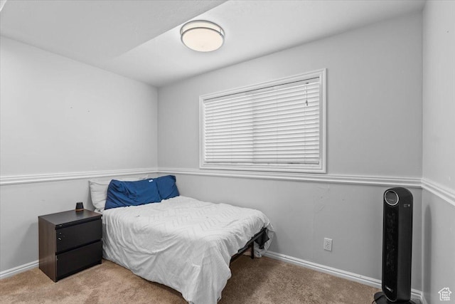 carpeted bedroom with baseboards