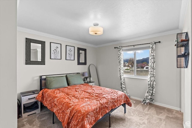 carpeted bedroom with baseboards and ornamental molding