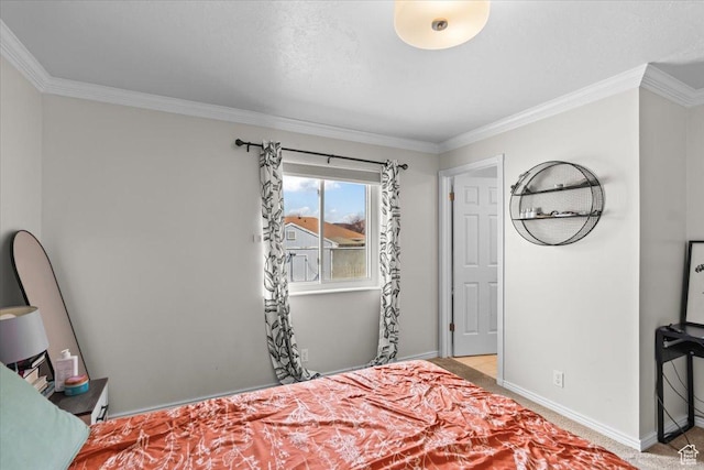 bedroom with crown molding, light colored carpet, and baseboards