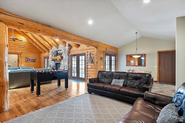living area with log walls, lofted ceiling with beams, recessed lighting, french doors, and hardwood / wood-style floors