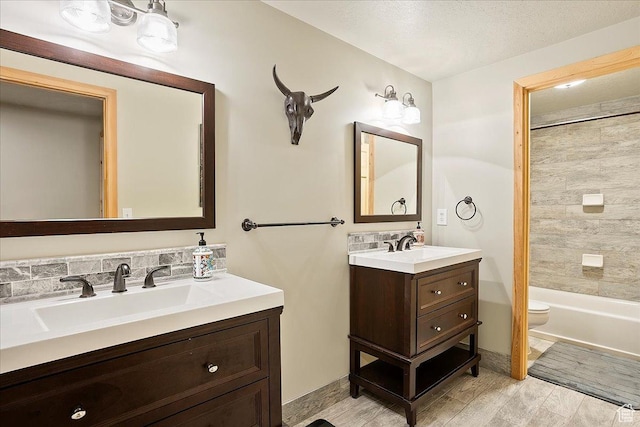 full bathroom with vanity and toilet