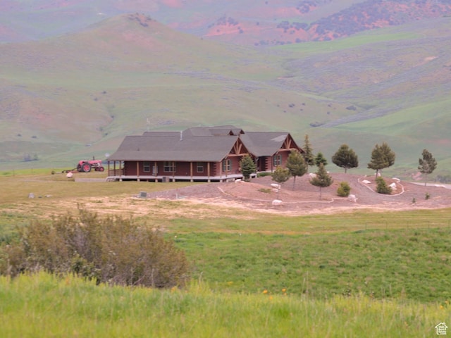 aerial view with a mountain view and a rural view