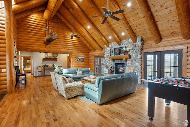 living room featuring ceiling fan, light wood-type flooring, wood ceiling, french doors, and high vaulted ceiling