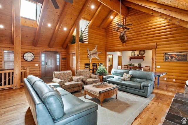 living area featuring wood ceiling, ceiling fan, beamed ceiling, and hardwood / wood-style flooring