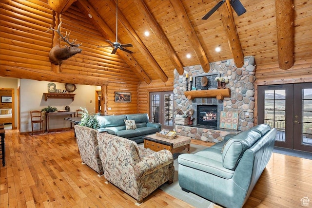 living room with french doors, light wood-type flooring, and a ceiling fan